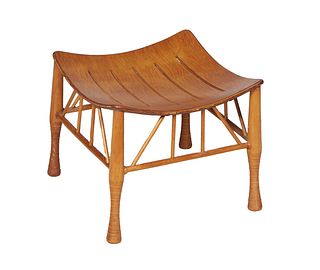 Mid-Century Modern Walnut Stool, 20th c., the curved top with pierced horizontal slats, on turned tapered cylindrical legs, joined by a walnut skirt, 