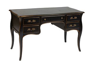 Louis XV Style Ebonized Beech Desk, 20th c., the rounded gilt edge tortoise top over a center frieze drawer flanked by banks of two small drawers, on 