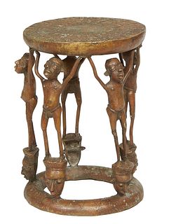 African Benin Bronze Chief's Stool, 20th c., the relief decorated circular top on four figural male supports to a bottom circular rounded ring, H.- 16