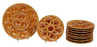 French Majolica Ten Piece Oyster Set, 20th c., by Longchamp, consisting of nine plates and a large matching circular platter, Plates- H.- 1 in., Dia.-
