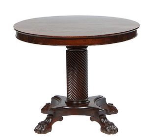 American Classical Carved Mahogany Center Table, 19th c., the circular top over a wide skirt, on a twist carved support to a quadruped base on large p