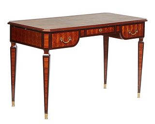Regency Style Banded Mahogany Desk, 20th c., the canted corner top with an inset gilt tooled writing surface over a center frieze drawer flanked by tw