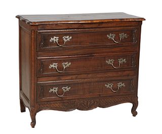 French Provincial Louis XV Style Carved Oak Commode, 19th c., the rounded stepped edge serpentine top over three drawers, flanked by rounded edge pila