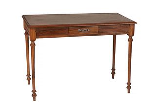 French Louis XVI Style Carved Walnut Writing Table, 20th c., the stepped rectangular top over a frieze drawer, on turned tapered reeded legs with toup