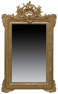 French Louis XVI Style Gilt and Gesso Overmantel Mirror, 19th c., with a pierced shell, floral and scrolled crest over a wide frame with relief scroll