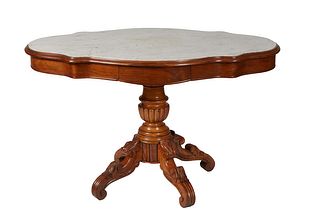 French Carved Walnut Marble Top Center Table, c. 1870, the inset figured white tortoise marble over a wide skirt with a frieze drawer on each long sid