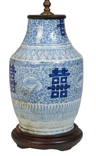 Chines Blue and White Porcelain Baluster Urn, 19th c., with floral and double happiness decoration, now with a wooden caped base and wired as a lamp, 
