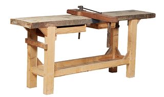 French Provincial Cabinetmaker's Workbench, 19th c., the thick oak top on pine block legs joined by a galleried lower shelf, the top with a removable 