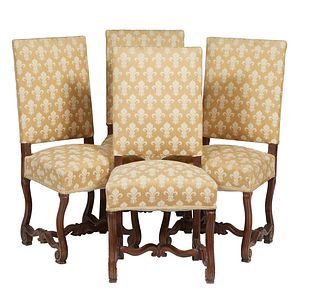 Set of Four French Louis XIII Style Carved Oak Dining Chairs, 20th c., the high upholstered back over an upholstered trapezoidal seat, on cabriole leg