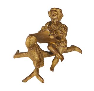 Small Continental Bronze, 19th c., of a boy seated on a tree stump, writing, H.- 2 in., W.- 3 1/2 in., D.- 2 3/4 in.