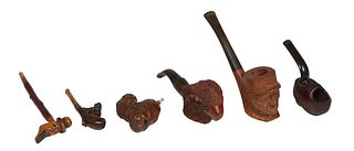 Group of Six Pipes, 19th c., one of a Viking Warrior; one a Dutch shoe example; one of a French legionnaire; one a miniature example with a carved mon