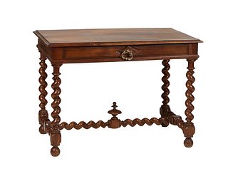 French Louis XIII Style Carved Walnut Writing Table, c. 1880, the stepped top over a long frieze drawer on rope twist trestle supports, joined by a ro