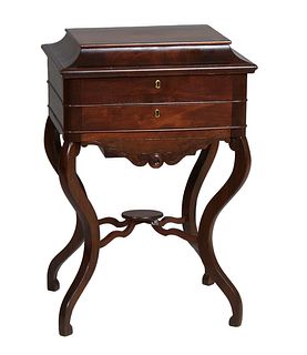 American Carved Rosewood and Mahogany Work Table, 19th c., the ogee edge lid with an interior mirror and divided interior above a shallow compartmente