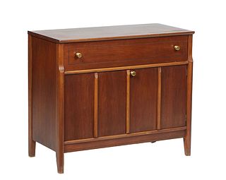 Mid-Century Modern Carved Walnut Server, 20th c., the rectangular top over a frieze drawer above double cupboard doors, on cylindrical legs, H.- 31 in