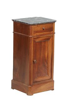 Two French Nightstands, the first a French Provincial Louis Philippe Carved Walnut Marble Top Nightstand, late 19th c., the canted corner figured grey