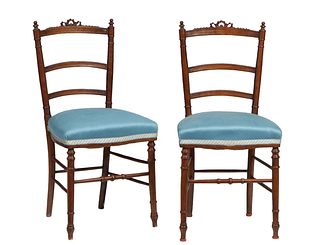 Pair of Carved Walnut Louis XVI Style Side Chairs, early 20th c., the arched canted ribbons carved back with three horizontal splats, to a cushioned b