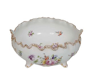 German Porcelain Center Bowl, 19th c., probably Tiefenfurt, Silesia, the gilt decorated undulating rim, over floral painted sides, on four splayed scr