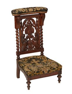 French Carved Walnut Louis XIII Style Prie Dieux, late 19th c., the curved arm crest over a pierced back with angel decoration, flanked by rope twist 