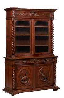 French Henri II Style Carved Oak Buffet a Deux Corps, c. 1880, the stepped breakfront crown over setback double glazed doors, flanked by rope twist co