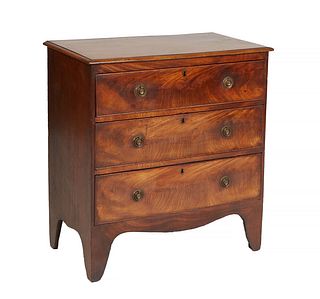 Diminutive English Carved Mahogany Georgian Style Chest, early 20th c., the stepped rounded top over three graduated drawers on a plinth base with bra