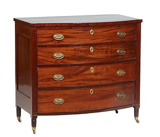 English Carved Mahogany Bowfront Chest, late 19th c., the thick bowed top over a setback bank of four bowed drawer flanked by reeded pilasters, on tur