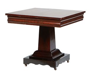 American Classic Carved Mahogany Breakfast Table, 19th c., the rectangular top over an ogee skirt, on a tapered square pedestal, to a square base with