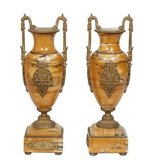 Pair of Bronze Mounted Baluster Highly Figured Ocher Marble Urns, 19th c., with snake head and floral handles, over a pierced bronze medallion on one 