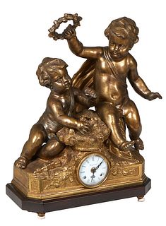 German "Imperial" Louis XV Style Figural Brass Mantel Clock, 20th c., by Franz Hrermle, with two large seated putti, over an enamel dial time and stri
