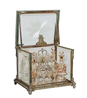 French Cut Crystal and Gilt Brass Cave a Liqueur, early 20th c., with beveled cut crystal sides and top opening to a lift out tray fitted with four gi