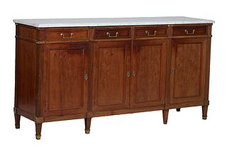 French Louis XVI Style Carved Walnut Marble Top Sideboard, 20th c., the figured block corner white marble over two center frieze drawers over double c