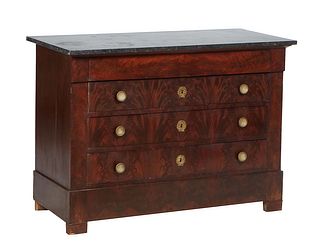 French Empire Style Carved Walnut Marble Top Commode, 19th c., with a black figured marble over a setback frieze drawer and three deep drawers, on a p