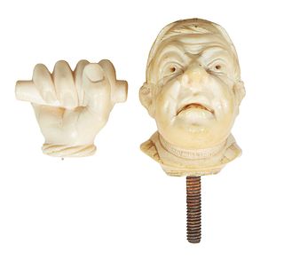 Two Carved Ivory Cane Handles, early 20th c., one of a hand; the other a cleric with a cap, H.- 2 5/8 in., W.- 2 1/2 in., D.- 1 3/8 in.
