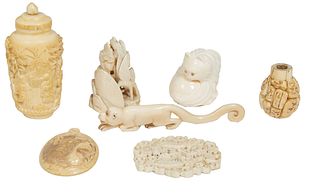 Group of Seven Carved Ivory Pieces, early 20th c., one an oriental snuff bottle and lid; one of a clam shell and bird; a pierced relief pendant, a fig