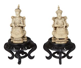 Chinese Carved Ivory Emperor and Empress Figures, 20th c., with ebonized carved hardwood stands, H.- 7 1/2 in., W.- 2 1/2 in., D.- 2 1/4 in.