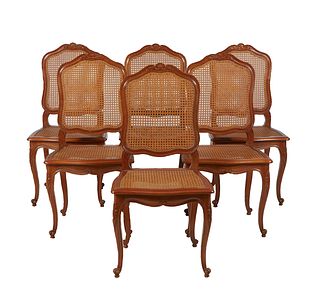 Set of Six French Louis XV Style Carved Cherry Dining Chairs, 20th c., the arched canted shell carved backs to bowed caned seats, on cabriole legs wit