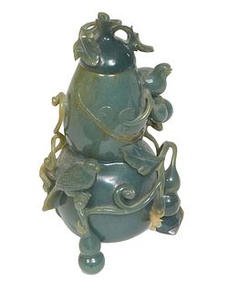 A Burmese Jade covered jar with relief figural birds and leaves, with original bill of sale, H.- 6 1/2 in., Dia.- 3 1/2 in.