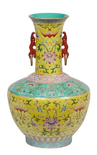 Chinese Yellow Gourd Porcelain Baluster Vase, 20th c., the everted rim over a tapered neck with applied Foo dog and ring handles above a floral panel 