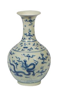 Chinese Blue and White Porcelain Bottle Vase, with dragon decoration, the underside with a six character blue underglaze mark, H.- 9 in., Dia.- 5 in.