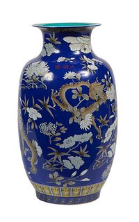Large Chinese Porcelain Baluster Vase, 20th c., with floral and dragon decoration on a bright blue ground, the underside with a four character red und