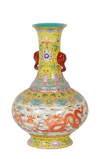 Chinese Yellow Gourd Porcelain Baluster Vase, 20th c., the everted rim over a tapered neck with elephant form handles, above a floral and dragon decor