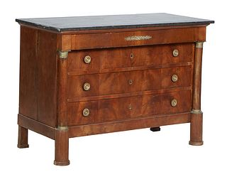 French Empire Style Ormolu Mounted Carved Walnut Marble Top Commode, c. 1840, the figured black marble over a frieze drawer and three setback deep dra