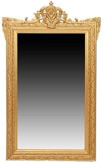 French Louis XV Style Gilt and Gesso Overmantle Mirror, 19th c., with a pierced arched scrolled floral crest over a wide relief frame with floral and 