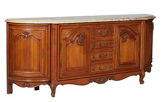 French Louis XV Style Carved Walnut Marble Top Sideboard, 20th c., the rounded edge ogee figured ocher marble over a central bank of four fielded pane