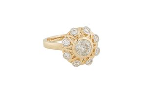Lady's 18K Yellow and White Gold Dinner Ring, with a central 1.01 ct. round diamond atop a circular border of eight round diamonds, diamond accent wt.