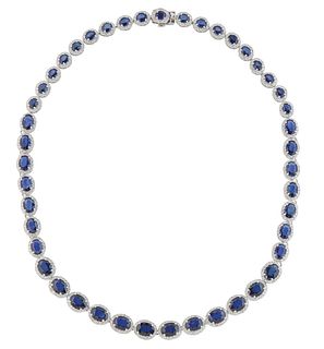 14K White Gold Link Necklace, each of the forty-five oval links with a graduated oval blue sapphire, atop a border of tiny round diamonds, total sapph