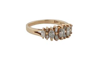 Lady's 14K Yellow Gold Dinner Ring, the top with five graduated marquise diamonds, separated by two baguette diamonds, on a split shoulder band, total
