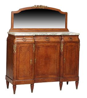 French Art Deco Inlaid Carved Walnut Ormolu Mounted Server, early 20th c., the arched back wide beveled mirror over the ogee edge break front highly f