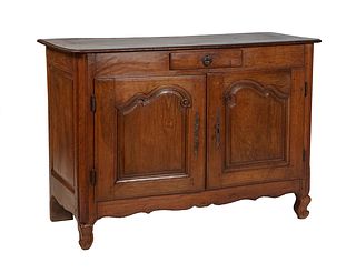 French Provincial Louis XV Style Carved Oak Sideboard, 19th c., the stepped rounded corner top over a center frieze drawer over double fielded panel d