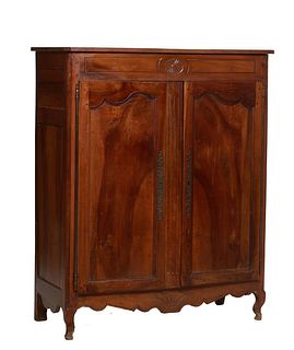 Diminutive French Carved Louis XV Style Walnut Armoire, 20th c., the canted corner top over a carved frieze above double paneled doors with long iron 