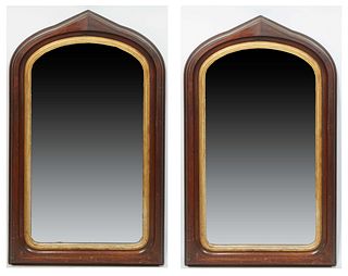 Pair of American Carved Mahogany Gilt Gothic Revival Overmantel Mirrors, 19th c., of Gothic arch form, the wide reeded frame over an arched plate with
